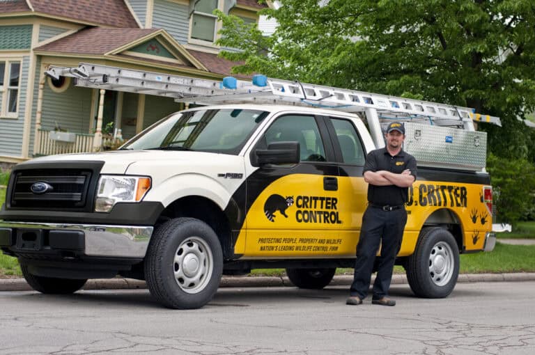 Critter Control field technician at customer location